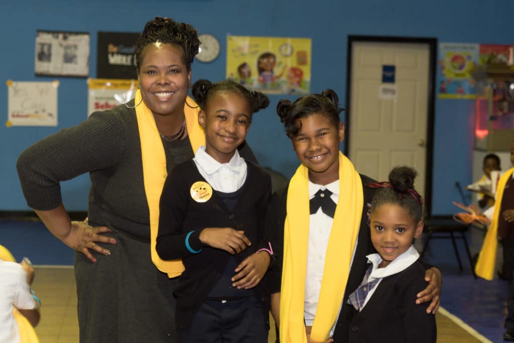 Mother smiling with her three children