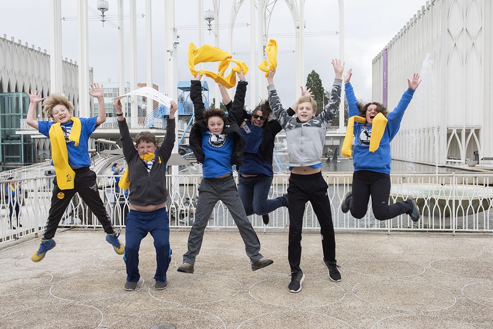 olympic-christian-school-students-jump-for-photo