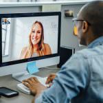 man and woman virtual meeting on laptop computer